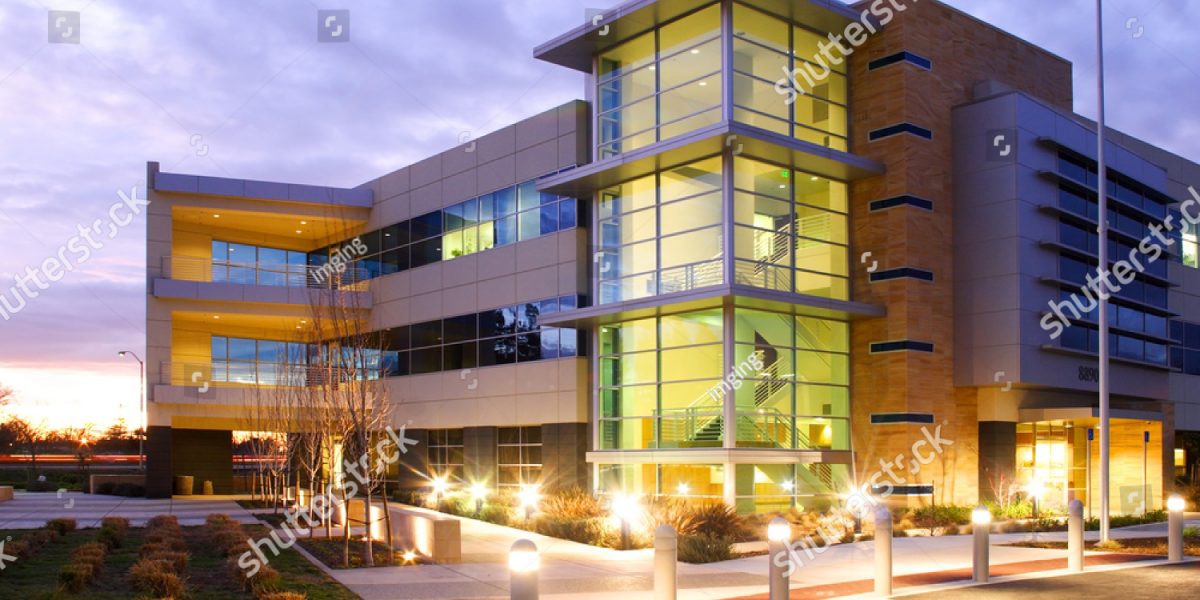 stock-photo-an-office-building-with-a-empty-parking-lot-15013609