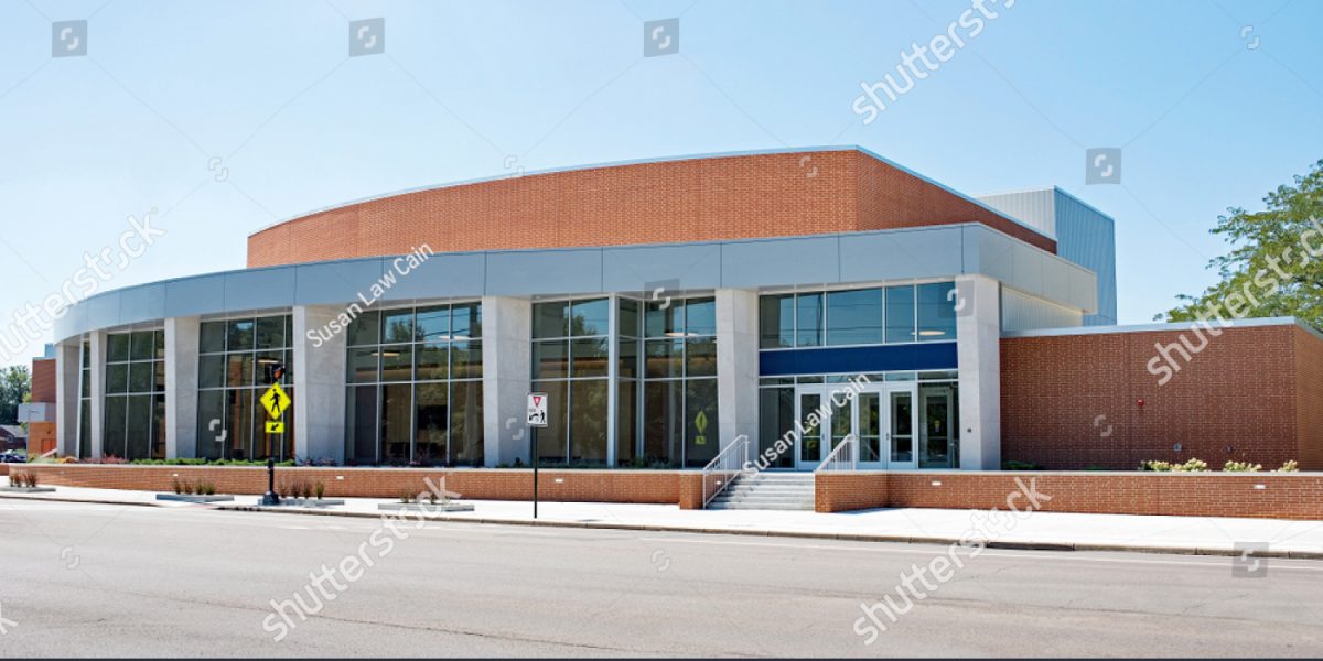 stock-photo-contemporary-red-brick-glass-convex-building-1496208446